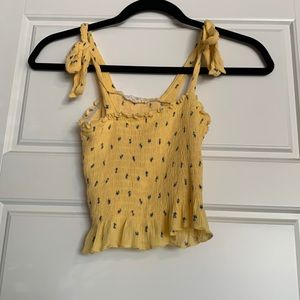Yellow flowy tank top with small blue flowers size XS